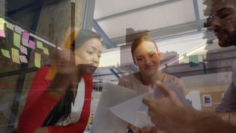 Cityscape Overlay with Diverse Business Team Collaboration