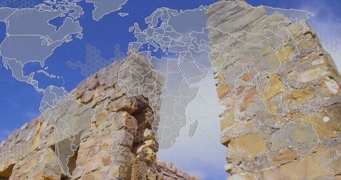 Featuring weathered sandstone ruins overlaid with global map and geospatial grid