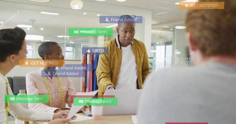 Leading creative team in studio with social media notifications and collaborative design meeting