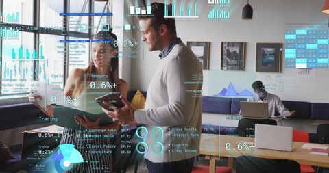 Diverse Professionals Analyzing Digital Financial Data in Office