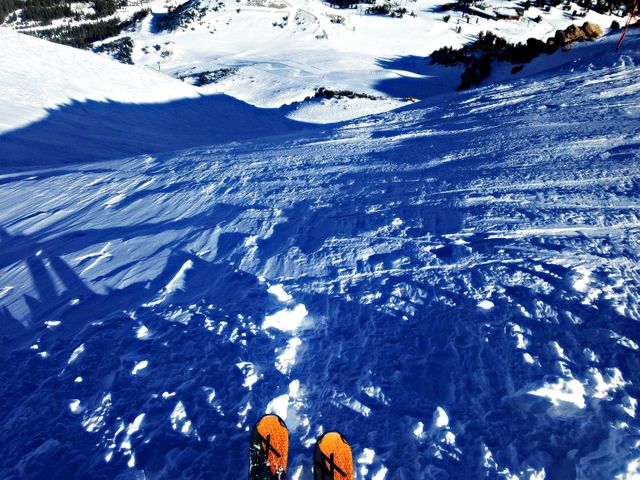 Skiing Down Snowy Mountain with Orange Ski Boots - Download Free Stock Photos Pikwizard.com