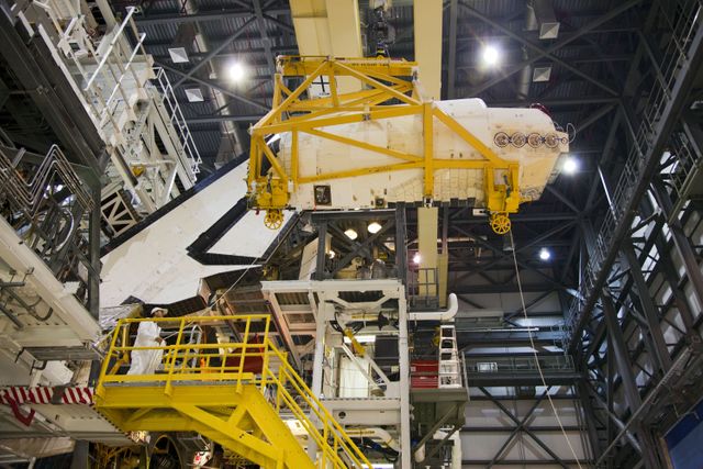 Orbital Maneuvering System Pod Removal from Shuttle Endeavour in NASA's Processing Facility - Download Free Stock Photos Pikwizard.com