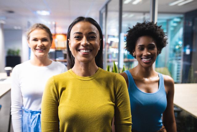 Portrait of smiling confident multiracial businesswomen standing in office. unaltered, business, teamwork, corporate business, occupation and office concept.