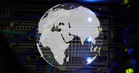 Rotating holographic globe showing global network connections over data center servers