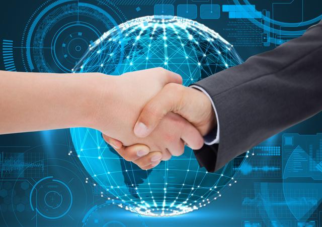 Digital composition of business executives shaking hands against glowing sphere in background