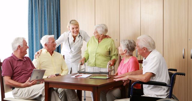 Smiling Nurse Engaging with Happy Seniors in Assisted Living Home - Download Free Stock Images Pikwizard.com