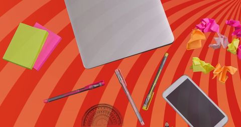 Modern office desk with laptop and supplies