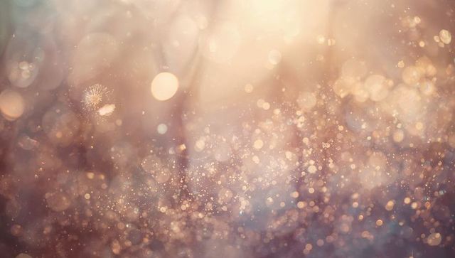Golden pink bokeh dreamscape with glitter dust, sun flare and floating light particles