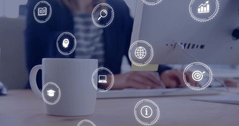 Businesswoman Typing with Overlay of Business Icons in Professional Workspace