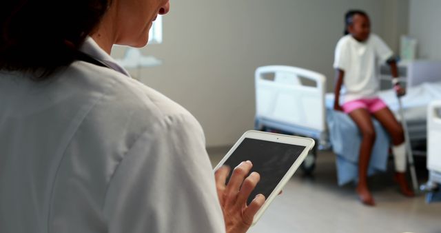 Doctor Using Tablet in Hospital Room with Patient - Download Free Stock Images Pikwizard.com