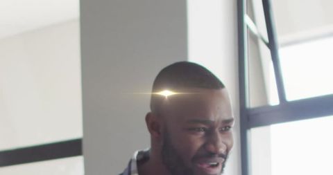 Enlightening Vision: African American Educator with Creative Light Overhead