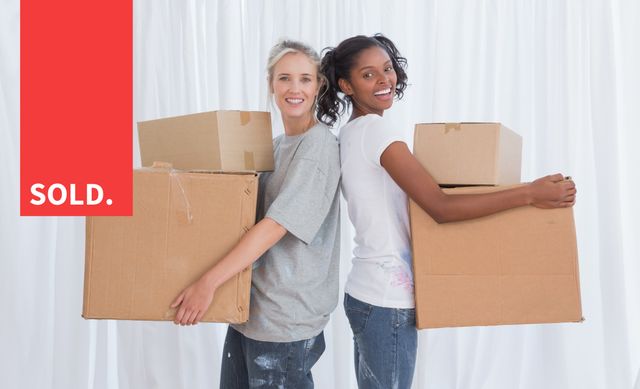 Two Women with Moving Boxes Celebrating New Home - Download Free Stock Templates Pikwizard.com