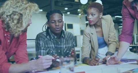Diverse Team Collaborating on Financial Strategy in Modern Office