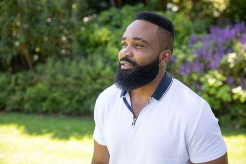 Elegant man in garden gaze