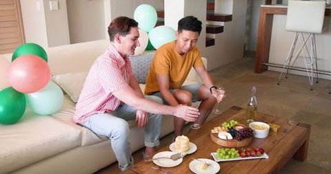 Loving couple celebrates birthday with cake and conversation