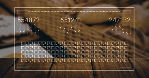 Transparent futuristic hud interface displaying digital counters over warm wood tabletop