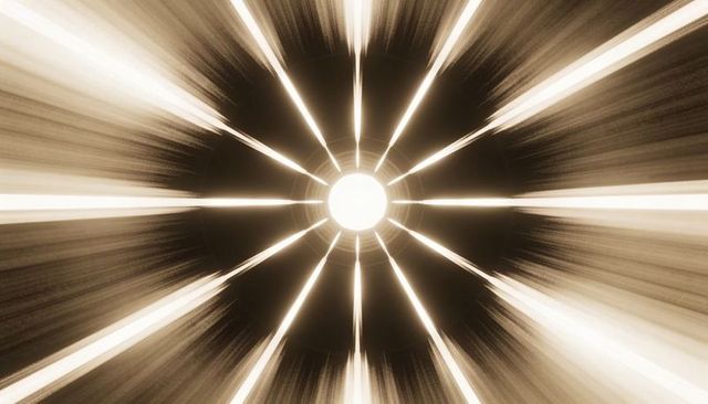 Sepia radial light burst radiating from central core with dark ring and motion streaks