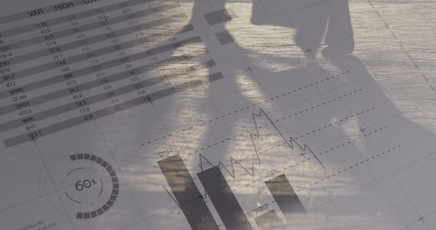 Business people walking with overlay of financial charts and data