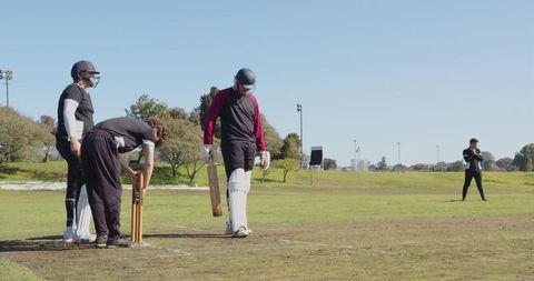 Batsman Preparing To Face Delivery in Cricket Match