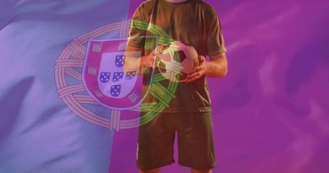 Soccer Player Holding Ball with Portuguese Flag Overlay