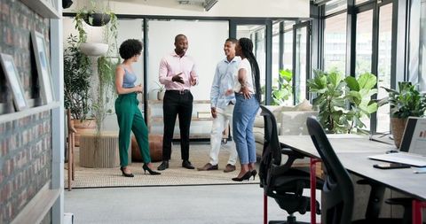 Business Team Collaborating in Modern Office Lounge
