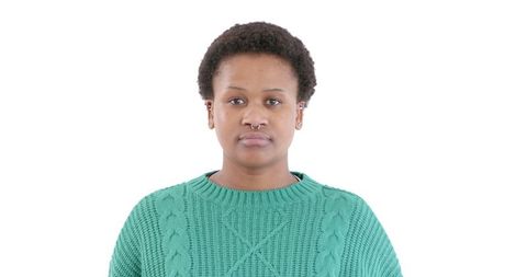 Thoughtful African American Woman in Green Sweater Looking Away