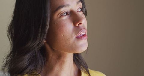 Profile of Serene Woman Enjoying a Calm Moment by Window