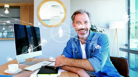 Smiling Businessman in Office with Digital Network Graphics