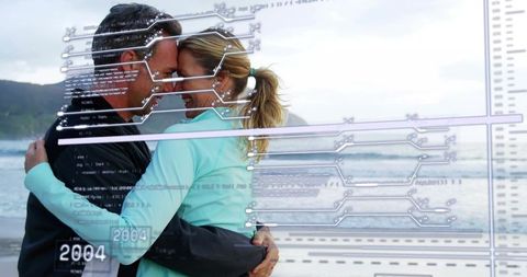 Couple embracing on beach with futuristic data overlay conveying tech and emotion