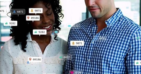 Colleagues reviewing social media engagement and analytics with notification overlays