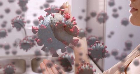Woman Explores Digital Coronavirus Model in Futuristic Kitchen Scene