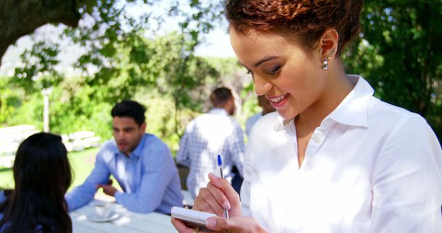 Smiling Waitress Taking Orders at Outdoor Cafe - Download Free Stock Images Pikwizard.com