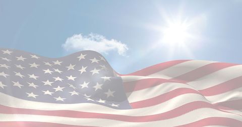 American Flag Waving Under Bright Sun Symbolizing Freedom