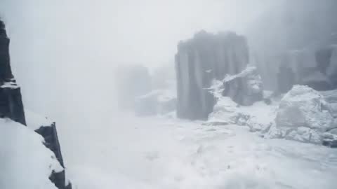 Drone Panning Over Snowy Canyon Revealing Towering Basalt Monoliths, Fog and Frost