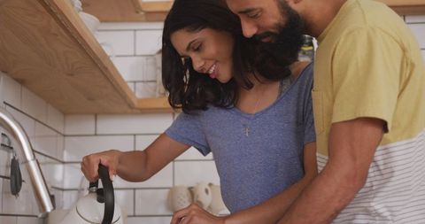 Couple Enjoying Peaceful Weekend Morning in Kitchen