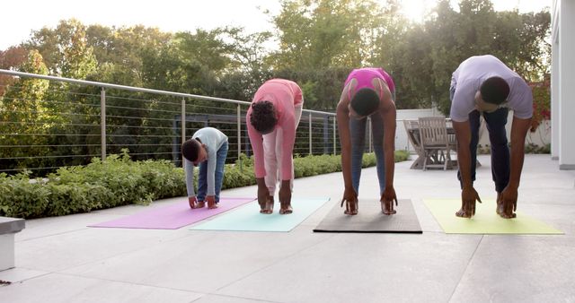 Family Practicing Outdoor Yoga During Sunset on Terrace - Download Free Stock Images Pikwizard.com