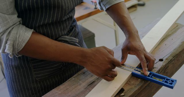 Woodworker Measuring and Marking Wooden Plank - Download Free Stock Images Pikwizard.com