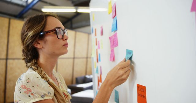 Female Professional Organizing and Planning with Sticky Notes on Whiteboard - Download Free Stock Images Pikwizard.com