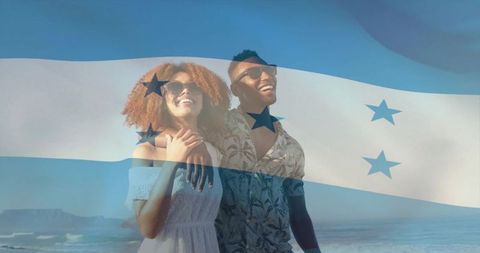 Smiling couple enjoying sunny beach with honduras flag overlay, summer romance and travel