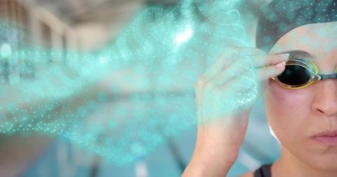 Focused Swimmer Prepared for Racing at Indoor Pool
