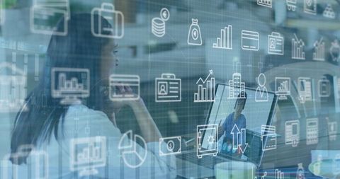 Businesswoman engaging in video call, digital financial icons overlay