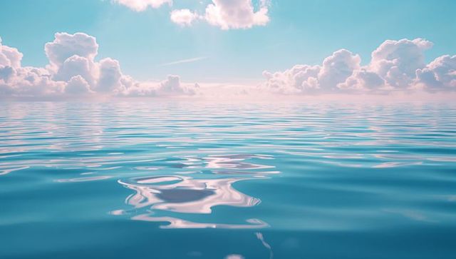 Calm Ocean Waves Meeting Bright Sky with Soft Clouds