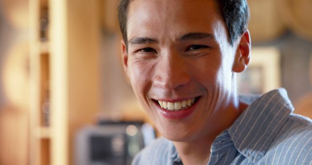 Smiling Young Man in Casual Shirt Enjoying Indoors - Download Free Stock Images Pikwizard.com