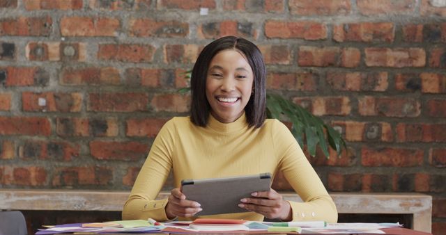 Smiling Woman Using Digital Tablet in Creative Workspace - Download Free Stock Images Pikwizard.com