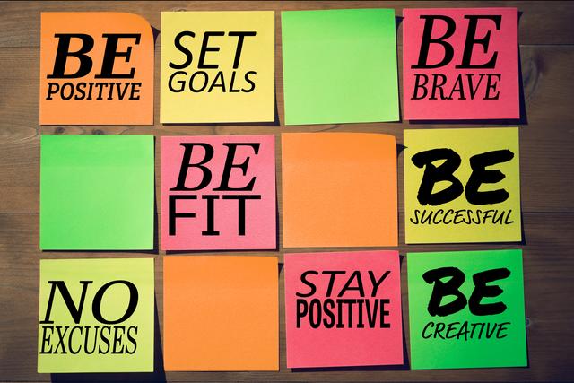 Colorful sticky notes with motivational messages such as 'Be Positive', 'Set Goals', and 'Be Brave' arranged on a wooden surface. Ideal for use in presentations, blogs, social media posts, and office decor to inspire and encourage positivity, goal setting, and creativity.