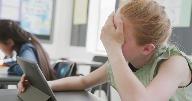 Stressed Student Learning Online with Tablet in Classroom - Download Free Stock Images Pikwizard.com