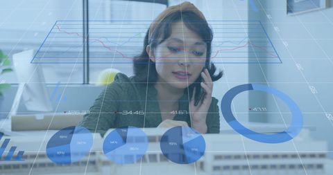 Asian Businesswoman Analyzing Data Visualization in Office - Download Free Stock Images Pikwizard.com