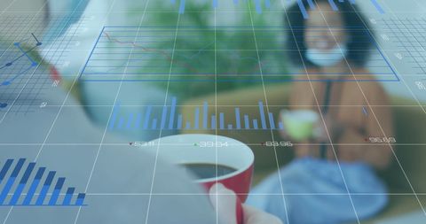 Businesswoman in a Mask Analyzing Digital Graphs on Laptop