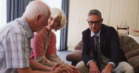 Senior Couple Consulting with Professional at Home