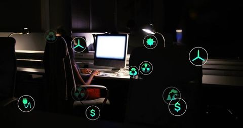 Businesswoman Typing at Night with Futuristic Energy Icons